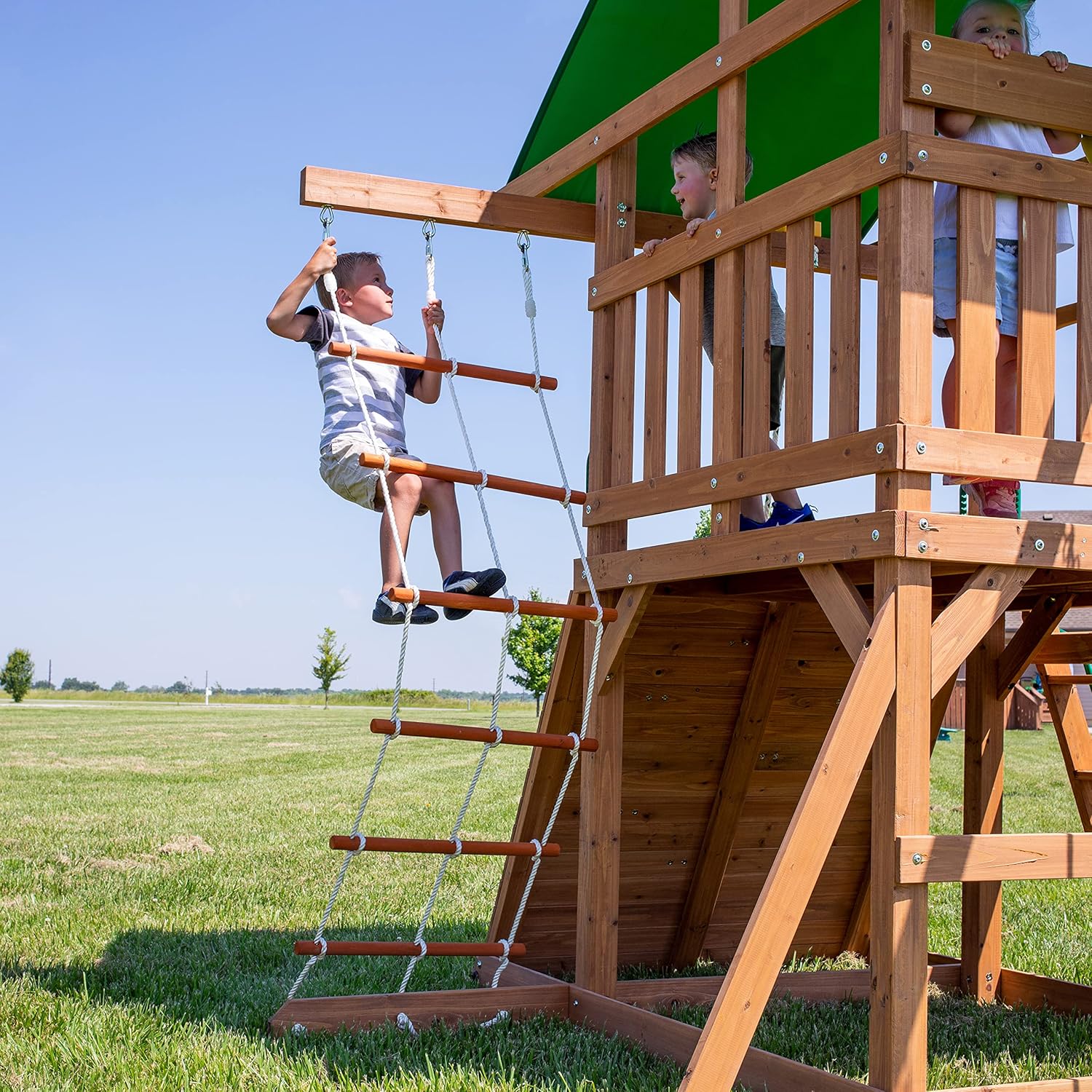 A complete set of wooden mountain-style swings, equipped with a colorful canvas sunshade, a wave slide, a rope swing, a net swing, and a rock wall with climbing ropes and ladders.1 pcs